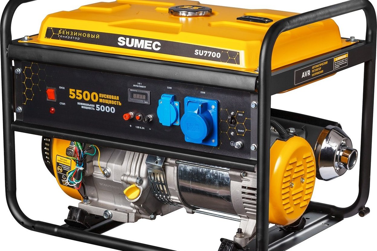 A portable inverter generator beside a camping trailer