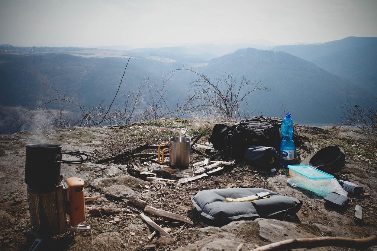 Camping gear and a cook pot set up at a campsite