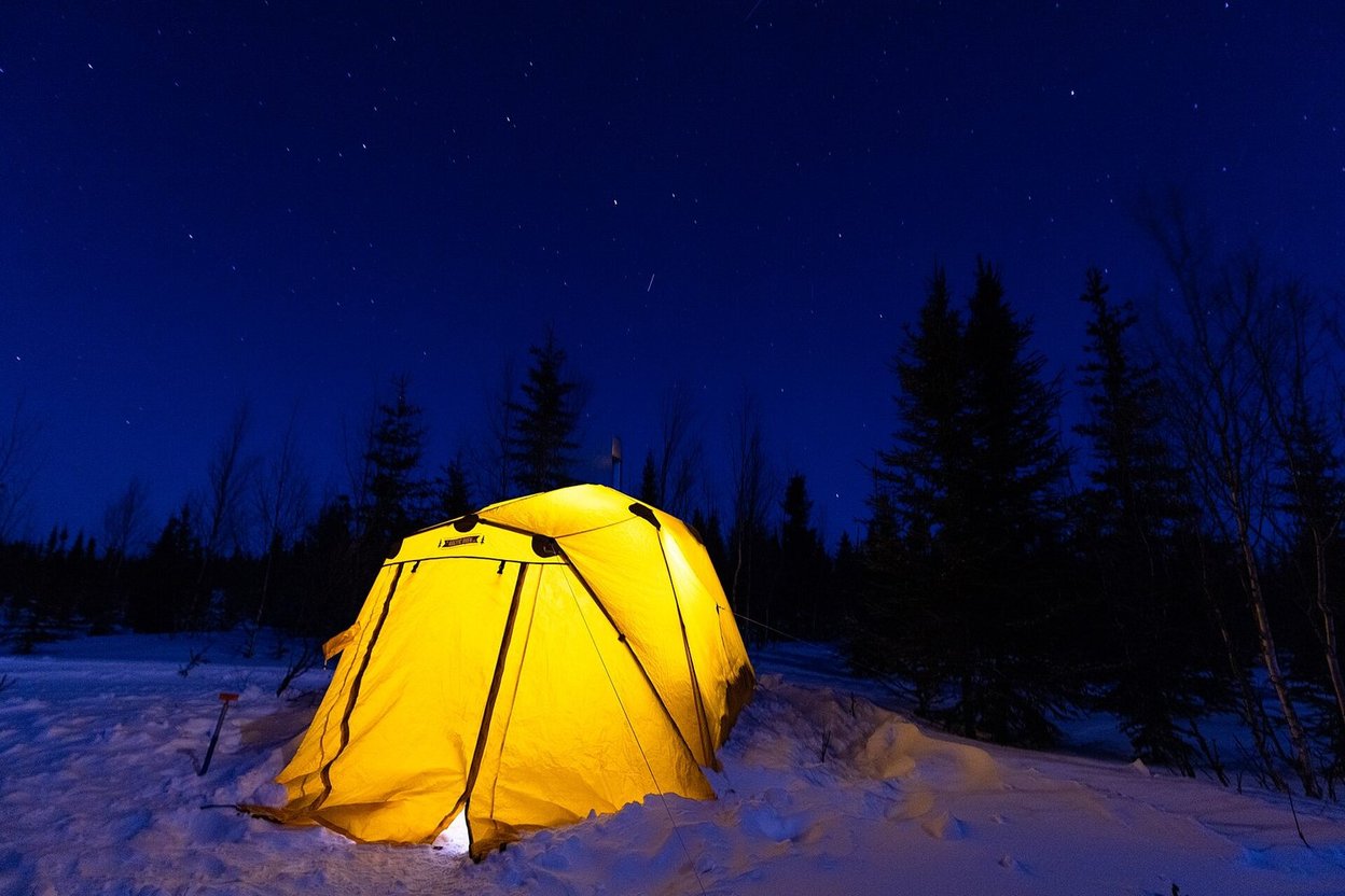 A tent at a campsite on a cold evening